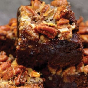 A close-up image of a stack of pecan pie brownies.