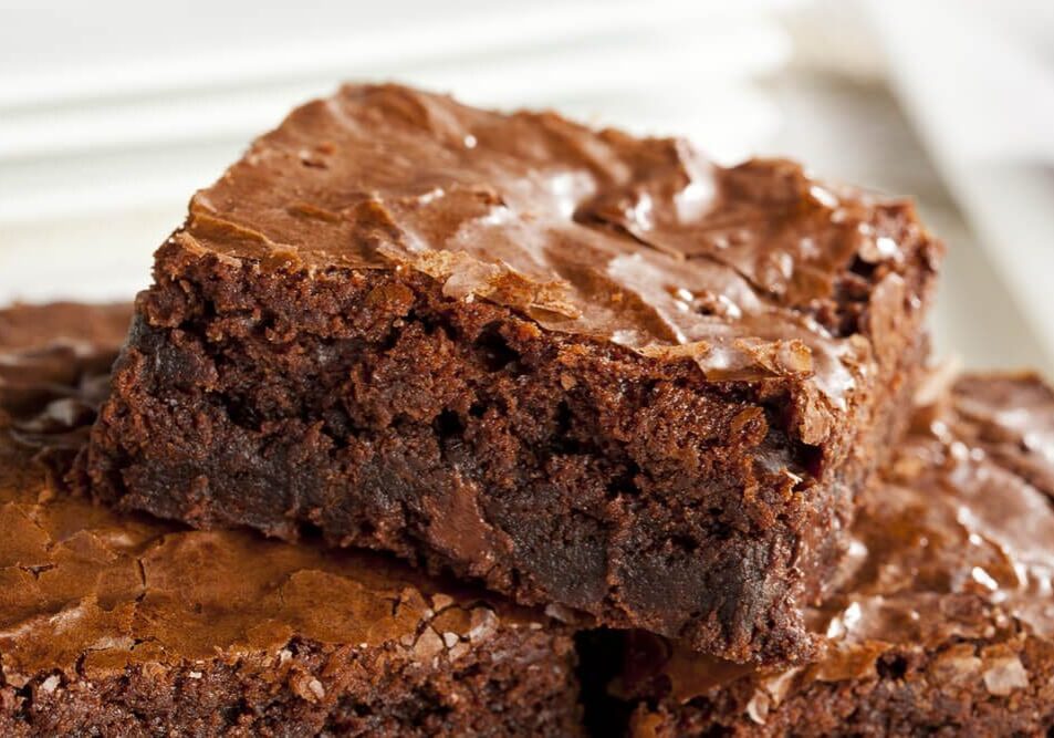 A close up of some brownies on top of each other