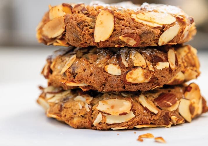 Stack of three almond cookies.